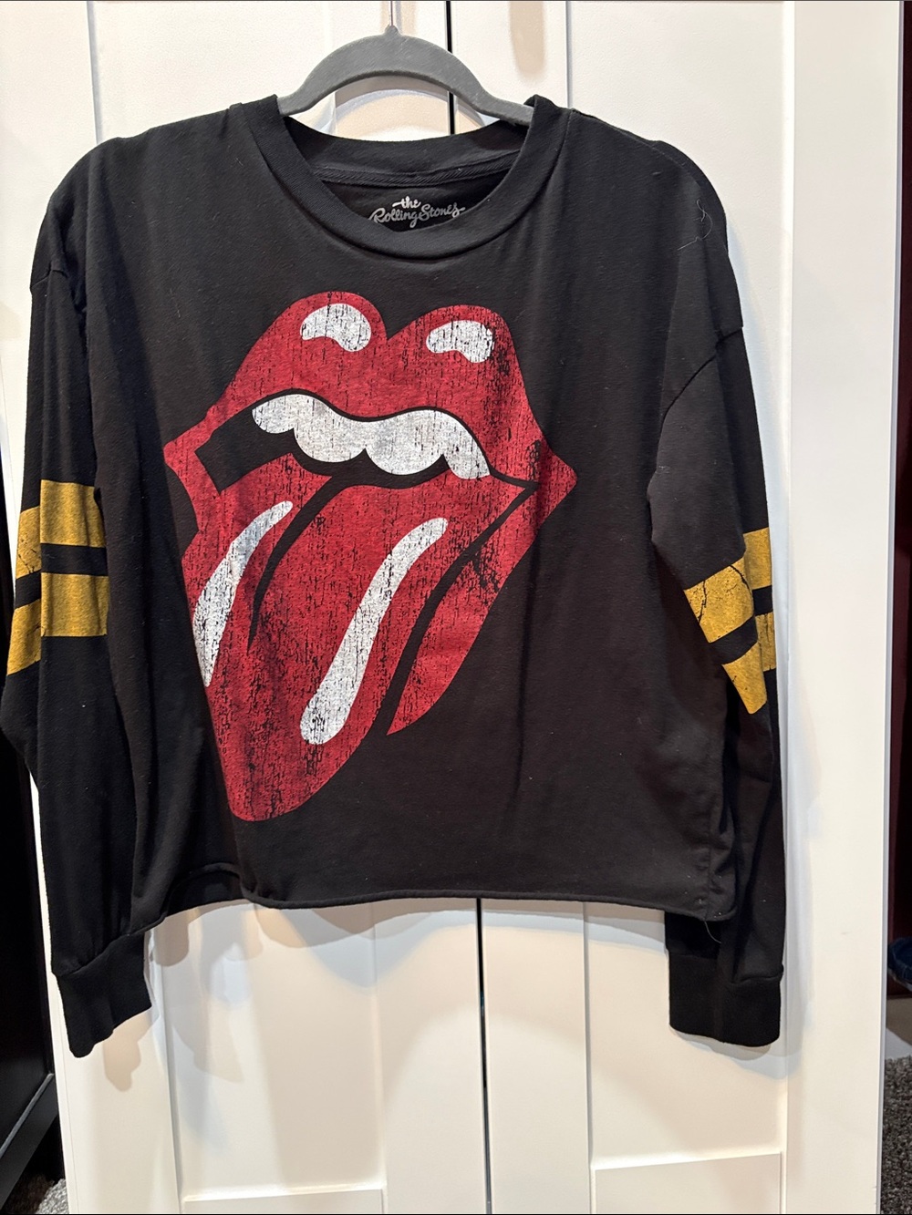 the Rolling Stones Black Long-Sleeve Tee with Red Tongue and Gold Sleeve Stripes